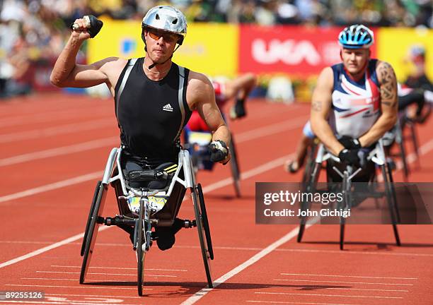 Marcel Hug of Switzerland celebrates as he crosses the line ahead of David Weir of Great Britain in the Men's T54 1500 Metres during day two of the...