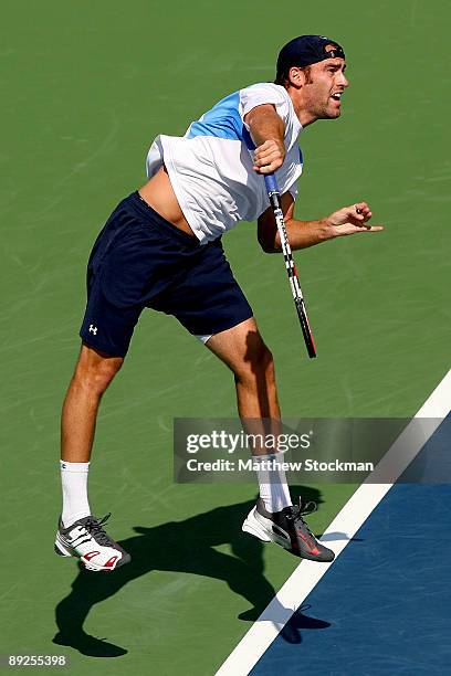 Robby Ginepri serves to John Isner during the semifinals of the Indianapolis Tennis Championships on July 25, 2009 at the Indianapolis Tennis Center...