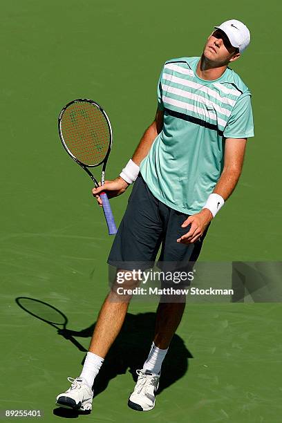 John Isner reacts to a lost point against Robby Ginepri during the semifinals of the Indianapolis Tennis Championships on July 25, 2009 at the...