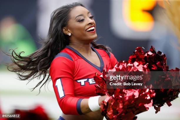 Olympic medalist Simone Biles performs with the Houston Texans cheerleaders during the game against the San Francisco 49ers at NRG Stadium on...