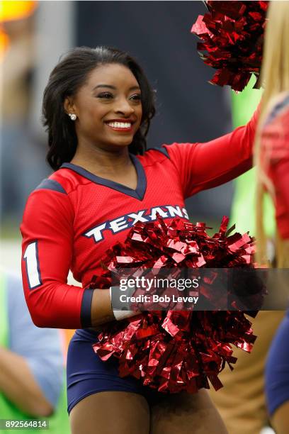 Olympic medalist Simone Biles performs with the Houston Texans cheerleaders during the game against the San Francisco 49ers at NRG Stadium on...