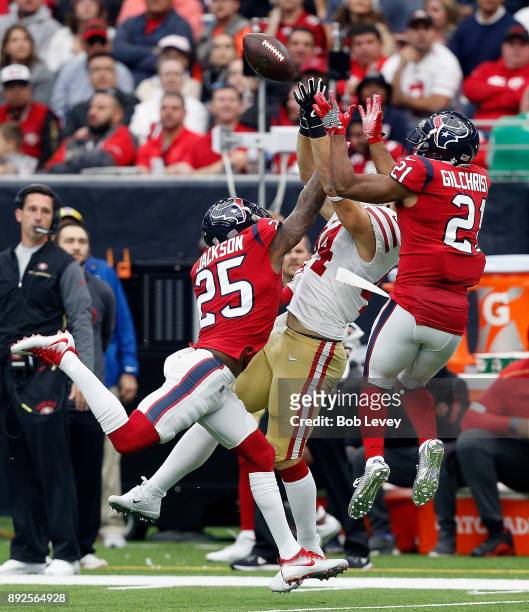Kendrick Bourne of the San Francisco 49ers goes up for the ball as Kareem Jackson of the Houston Texans and Marcus Gilchrist defend at NRG Stadium on...