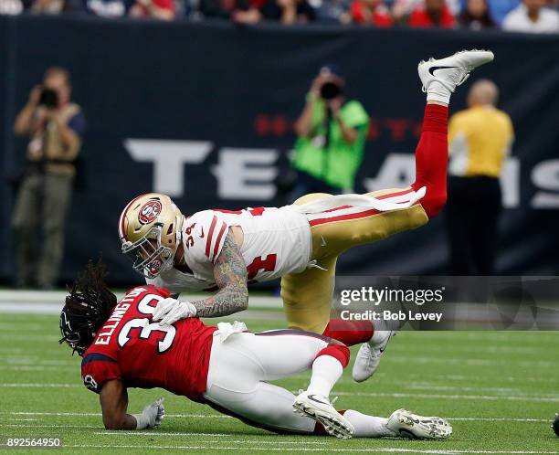 Andre Ellington of the Houston Texans is tackled by Cassius Marsh of the San Francisco 49ers at NRG Stadium on December 10, 2017 in Houston, Texas.