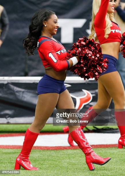Olympic gold medalist Simone Biles walks out as an honorary Houston Texans Cheerleader during the game against the San Francisco 49ers at NRG Stadium...
