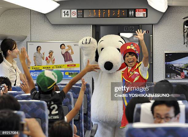 Cartoon character Snoopy greets guests in the Shinkansen bullet train heading to Osaka from Tokyo for the promotion of Osaka based Hollywood theme...