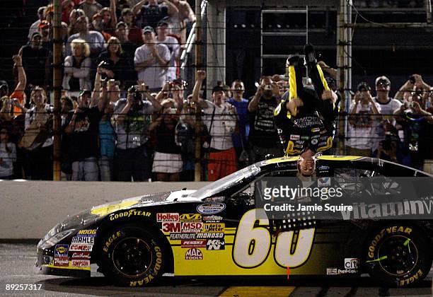 Carl Edwards, driver of the Vitamin Water Ford, celebrates after winning the NASCAR Nationwide Series Kroger 200 benefitting Riley Hospital for...
