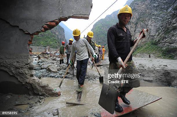 Chinese rescuers continue to arrive to dig for survivors after a rock slide in mountainous Kangding county, southwest China's Sichuan province on...