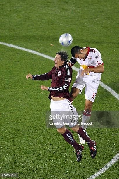 Facundo Diz of the Colorado Rapids fights for the ball against Mike Petke of the New York Red Bulls on July 25, 2009 at Dicks Sporting Goods Park in...