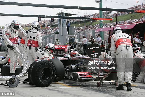 Heikki Kovalainen of Finland and McLaren Mercedes comes in for a tyre change during qualifying for the Hungarian Formula One Grand Prix at the...