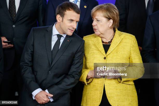 Angela Merkel, Germany's chancellor, right, speaks with Emmanuel Macron, France's president, during a Permanent Structured Cooperation in Defence...