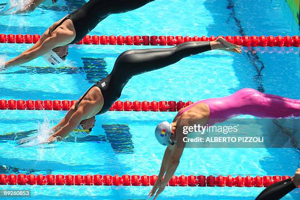 Allison Schmitt, Italy's Federica Pellegrini and Romania's Camila Alina Potec compete during the Women's 400m freestyle on July 26, 2009 at the 13th...