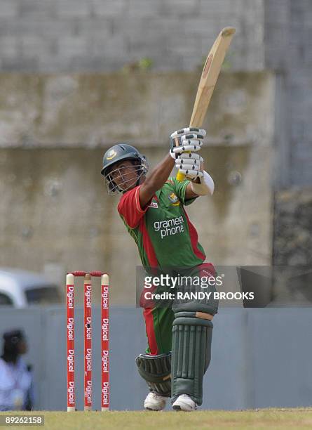 Bangladesh batsman Mohammad Ashraful drives West Indies bowler Kemar Roach for 4 runs during the 1st one day international West Indies v Bangladesh...