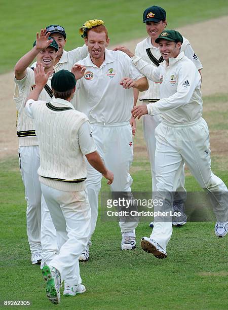Andrew McDonald of Australia is congratulated by team mates after taking the wicket of Ben Howgego of Northamptonshire during Day 3 of the...
