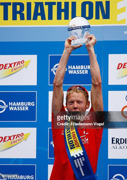 Maik Petzold of Germany celebrates leading overall standings on the podium after the Men's Dextro Energy Triathlon ITU World Championship on July 26,...