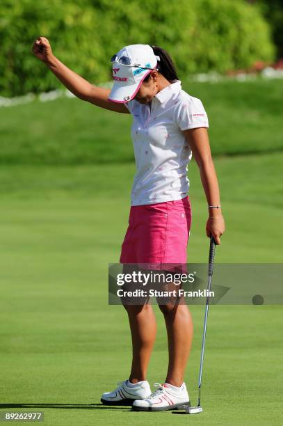 Ai Miyazato of Japan celebrates winning on the first playoff hole, the 18th, against Sofie Gustafson of Sweden after the final round of the Evian...