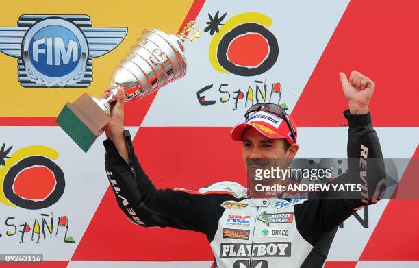 Randy De Puniet of France celebrates his third place on the podium after winning the British Grand Prix at Donington Park, in Leicestershire, central...