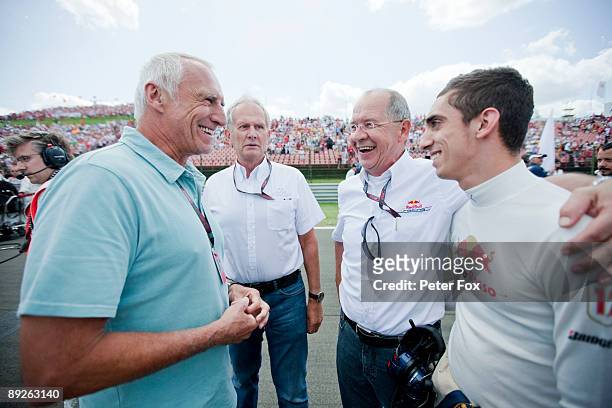 Sebastien Buemi of Switzerland and Scuderia Toro Rosso is seen with Red Bull owner Dietrich Mateschitz before the Hungarian Formula One Grand Prix at...
