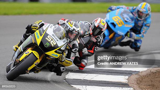 James Toseland of Britain leads Marco Melandri of Italy and Loris Capirossi of Italy at Donington Park, in Leicestershire, central England, on July...