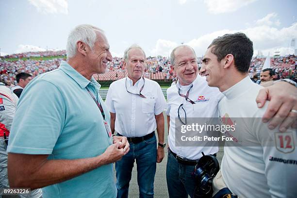 Sebastien Buemi of Switzerland and Scuderia Toro Rosso is seen with Red Bull owner Dietrich Mateschitz before the Hungarian Formula One Grand Prix at...