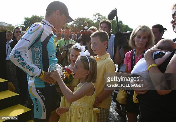 Tour de France third placed, seven-time Tour de France winner and Kazakh cycling team Astana 's Lance Armstrong of the United States talks to his...