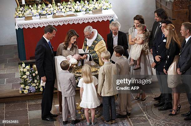 Bishop Erik Norman Svendsen christens the three month old son of Prince Joachim of Denmark and Princess Marie as Crown Princess Mary, Princess...