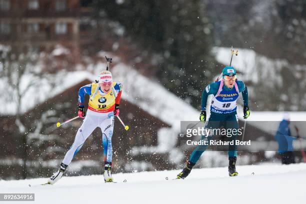 Kaiza Makarainen of Finland and Yuliia Dzhima of Ukraine perform during the IBU Biathlon World Cup Women's Sprint on December 14, 2017 in Le Grand...