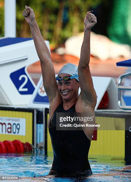 Federica Pellegrini of Italy celebrates after breaking the world record, setting a new time of 3:59.15 seconds in the Women's 400m Freestyle Final...