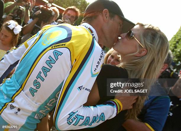 Tour de France third placed, seven-time Tour de France winner and Kazakh cycling team Astana 's Lance Armstrong of the United States kisses his...