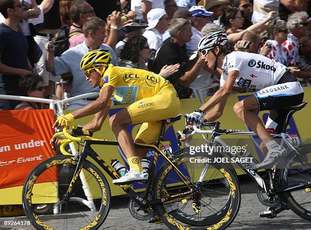 Yellow jersey of overall leader, 2007 Tour de France winner and Kazakh cycling team Astana 's leader Alberto Contador of Spain rides with second...