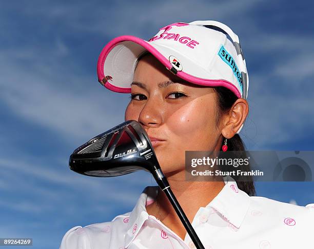 Ai Miyazato of Japan kisses her driver after winning in a playoff against Sofie Gustafson of Sweden during the final round of the Evian Masters at...