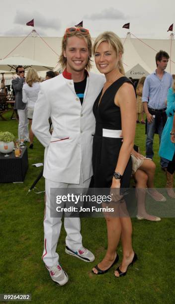 Sam Branson and Isabella Anstruther-Gough-Calthorpe pose at the Cartier Tent during the Cartier International Polo Day at Guards Polo Club on July...