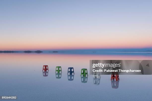 reflection of uyuni at sunrise, bolivia - salar de uyuni stockfoto's en -beelden