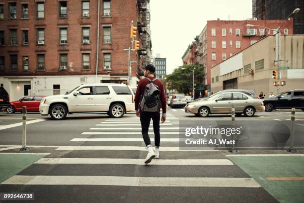 looks like it's all clear to walk - man walking in city stock pictures, royalty-free photos & images