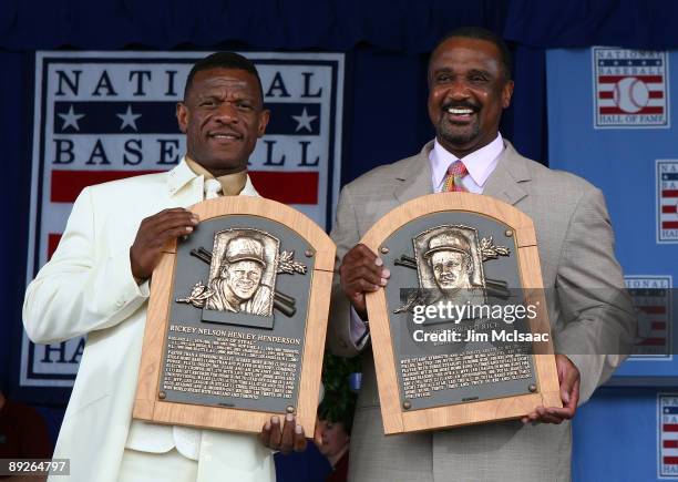 Inductees Rickey Henderson and Jim Rice pose for a photograph with their plaques at Clark Sports Center during the Baseball Hall of Fame induction...
