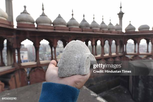 Piece of marble broken from the Jama Masjid dome on December 13, 2017 in New Delhi, India. The 17th century mosque built by Mughal emperor Shahjahan...