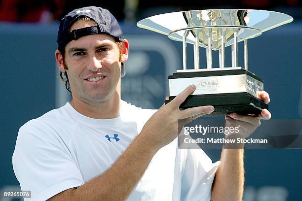 Robby Ginepri poses for photographers after defeating Sam Querrey during the final of the Indianapolis Tennis Championships on July 26, 2009 at the...