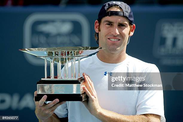 Robby Ginepri poses for photographers after defeating Sam Querrey during the final of the Indianapolis Tennis Championships on July 26, 2009 at the...