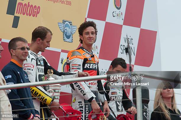 Andrea Dovizioso of Italy celebrates on the podium after the MotoGp race of the British MotoGP, at Donington Park Circuit on July 26, 2009 in...