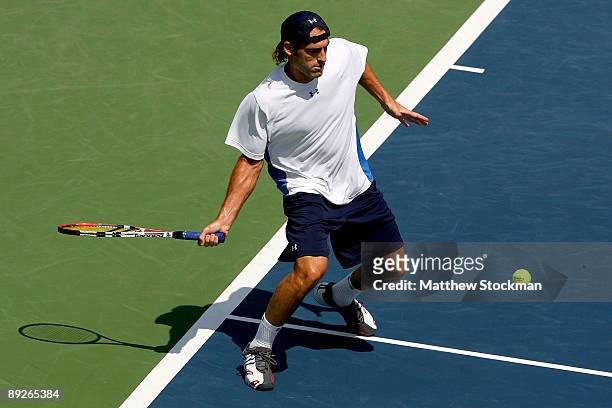 Robby Ginepri returns a shot to Sam Querrey during the final of the Indianapolis Tennis Championships on July 26, 2009 at the Indianapolis Tennis...