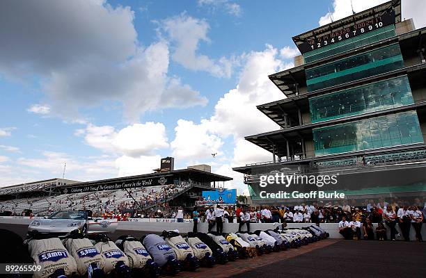 Jimmie Johnson, driver of the Lowe's/KOBALT Tools Chevrolet, and his crew members celebrate by kissing the bricks after Johnson wins the NASCAR...