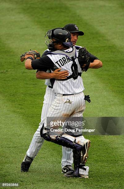 Relief pitcher Huston Street and catcher Yorvit Torrealba of the Colorado Rockies celebrate their 4-2 victory over the San Francisco Giants at Coors...