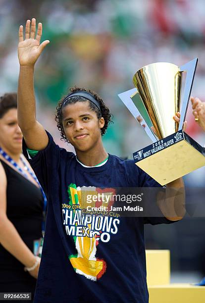 Mexican player Giovani dos Santos with his Most Valuable Player trophy after the victory of 5-0 against USA on the final match of CONCACAF Gold Cup...