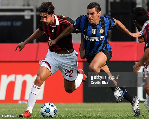 Marco Borriello of AC Milan tries to keep the ball from Lucio of Inter Milan on July 26, 2009 during the World Football Challange at Gillette Stadium...
