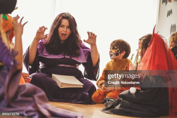 and then comes the scary creature... - story time stock pictures, royalty-free photos & images