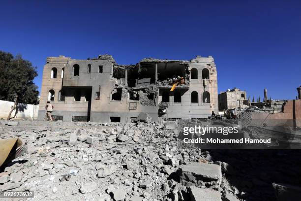Soldier walks on rubble of a prison after it was hit by airstrikes on December 13, 2017 in Sana’a, Yemen. More than 12 prisoners killed and 80 others...