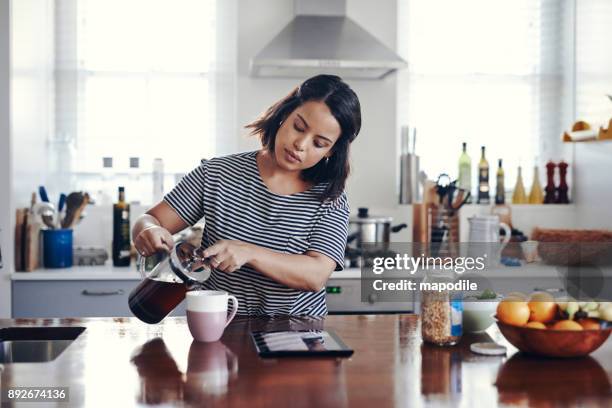 enjoying a fresh cup with fast connectivity - cafetiere stock pictures, royalty-free photos & images
