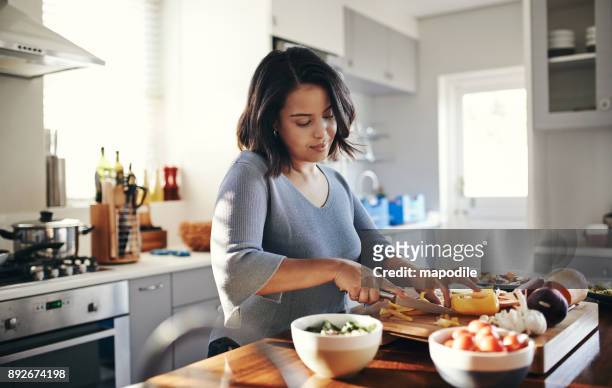 preparing her favourite dish - healthy eating stock pictures, royalty-free photos & images