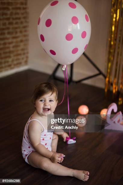 Happy Cute Little Baby Girl Playing With Ballon High-Res Stock Photo