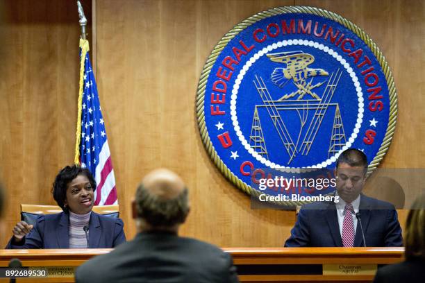 Mignon Clyburn, commissioner at the Federal Communications Commission , left, speaks as Ajit Pai, chairman of the FCC, right, listens during an open...