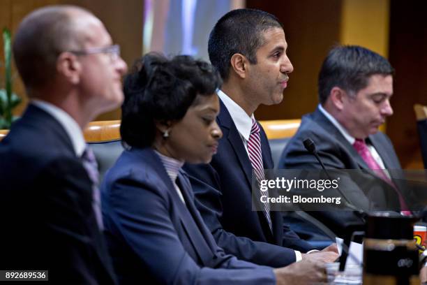 Ajit Pai, chairman of the Federal Communications Commission , center, speaks as FCC commissioners Brendan Carr, from left, Mignon Clyburn, and...